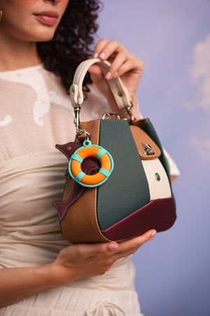 Cartera manos libres Dubai color verde y vinotinto de Hereje, colección Siete Colores