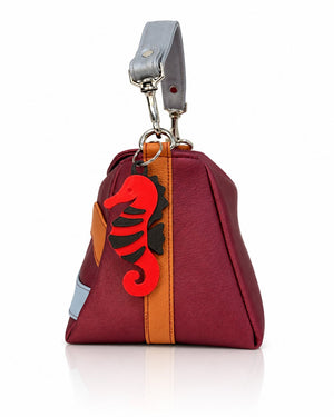 Cartera manos libres Japón color vinotinto de Hereje, colección Siete Colores