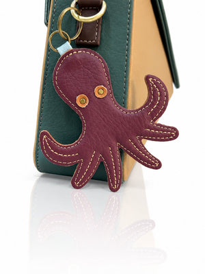 Cartera manos libres Nina color verde y beige de Hereje, colección Siete Colores