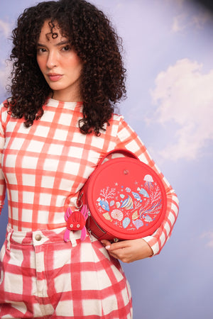 Cartera/morral manos libres Neptuno color rojo de Hereje, colección Siete Colores