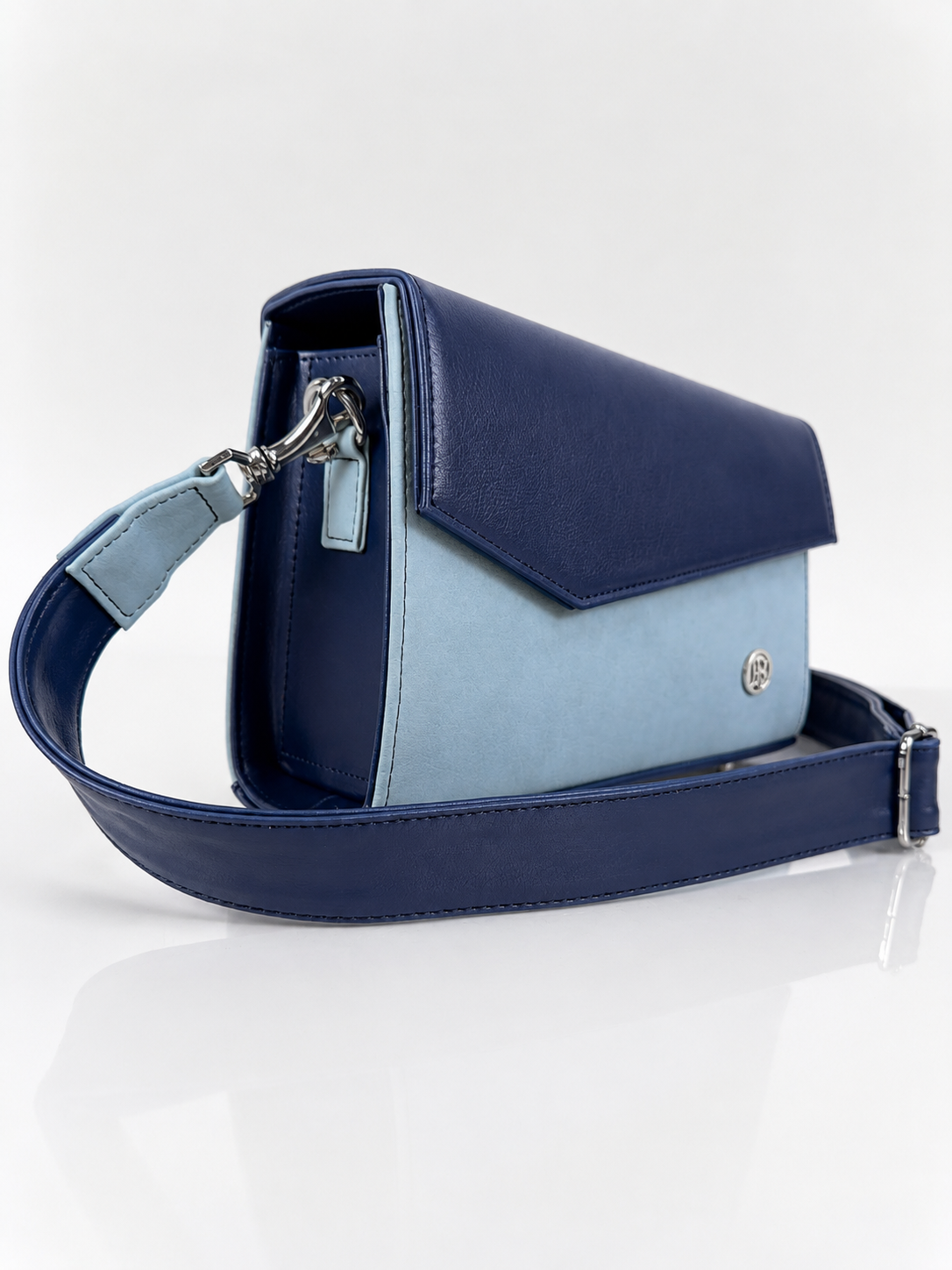 Bolso manos libres Mercurio, color azul oscuro y azul