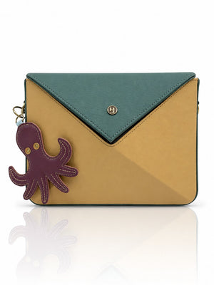 Cartera manos libres Nina color verde y mostaza de Hereje, colección Siete Colores