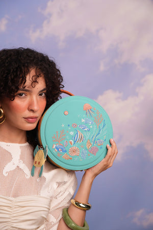 Cartera/morral manos libres Neptuno color turquesa de Hereje, colección Siete Colores